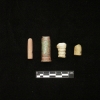 <p>Examples of expended ammunition found during the 2005-2006 archeological survey. Left to right are a .32-caliber slug, a .50-caliber cartridge, a Minié ball, and a .45-caliber slug. The Minié ball dates to or shortly after the Civil War; the other artifacts are from the late 19th or 20th centuries.</p>